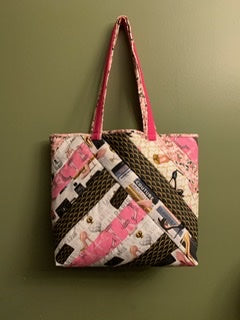 pink, brown, and white quilted bag