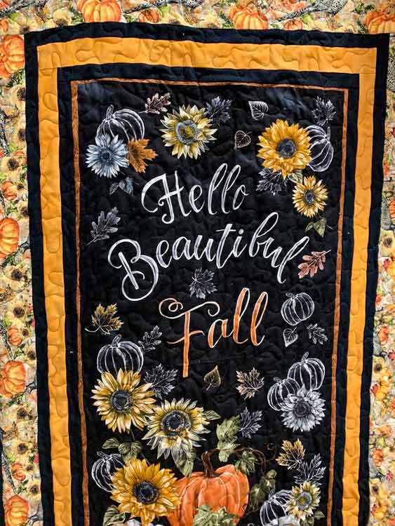 Hello Fall Lap quilt with a pumkin and floral design