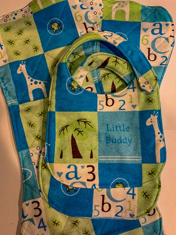 blue, green, and white bib and seat cover