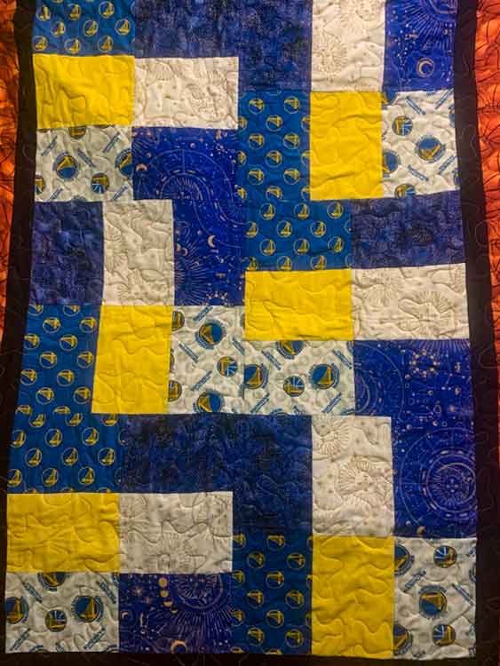 blue and yellow block quilt