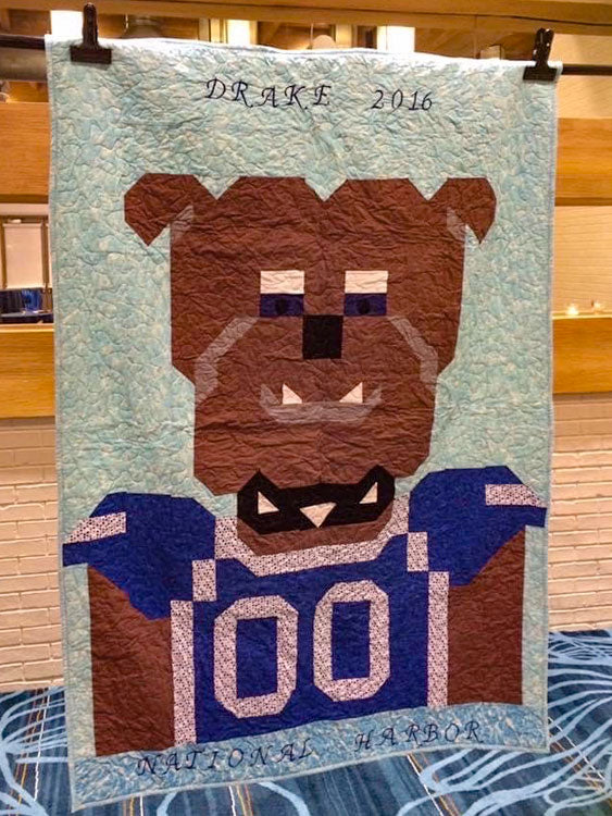 Dog with football jersey quilt made for drake in 2014