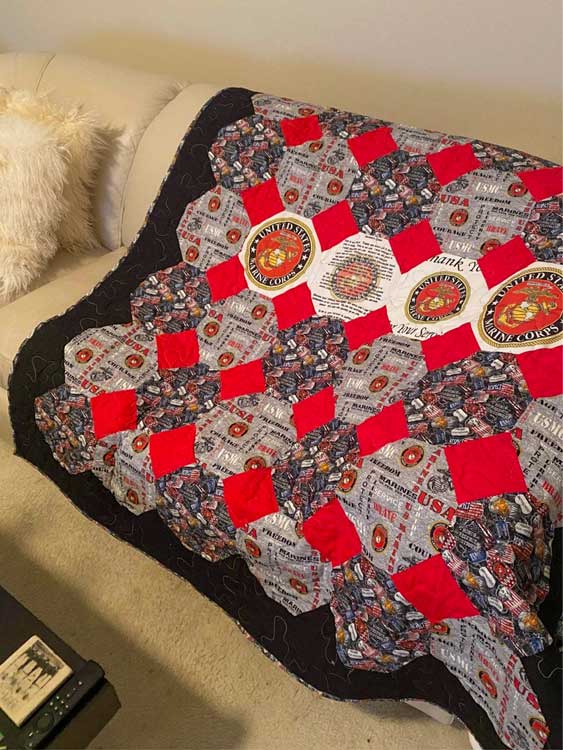 greyscale quilt with red accents for marine corps