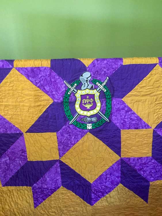 Purple and yellow pointed block quilt